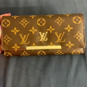 Super cute Louis Vuitton wallet with red inside